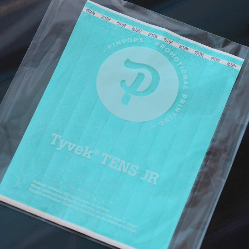 Aqua Tyvek Tens wristband with a permanent closure. Prenumbered in sequential order.