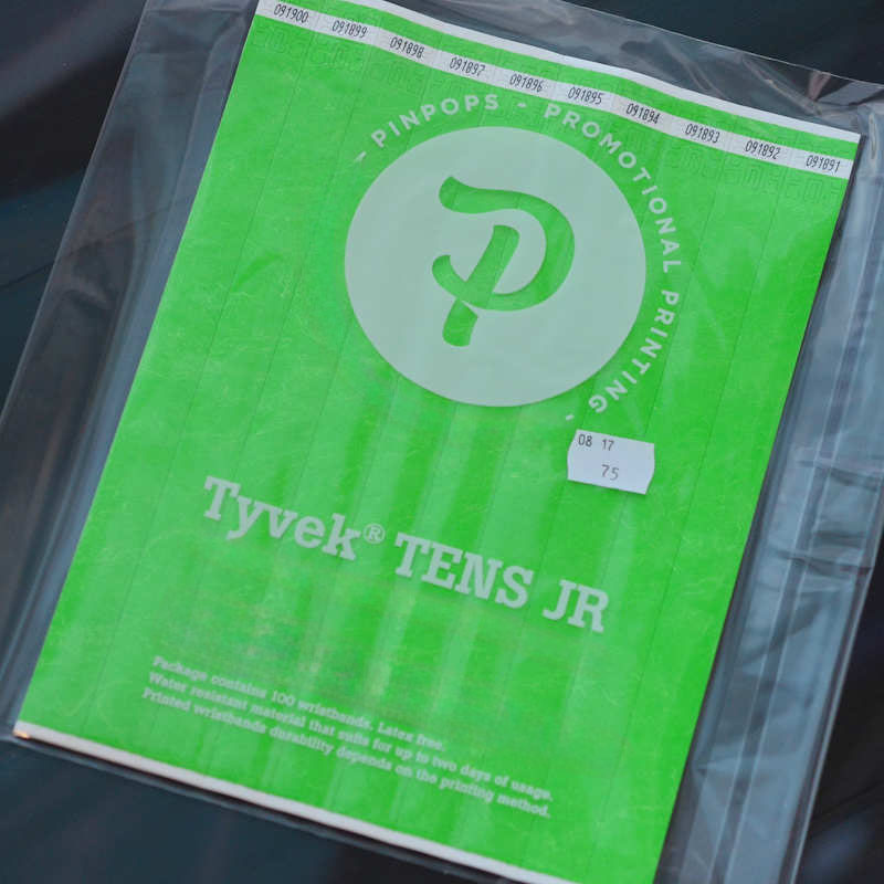 Lime Tyvek Tens wristband with a permanent closure. Prenumbered in sequential order.