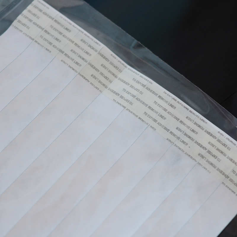 Lime Tyvek Tens wristband with a permanent closure. Prenumbered in sequential order.