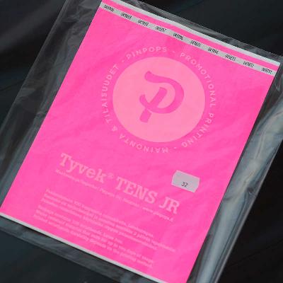 Day glow pink Tyvek Tens wristband with a permanent closure. Prenumbered in sequential order.